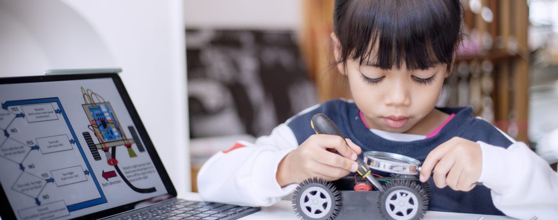 Asia students learn at home in coding robot cars and electronic board cables in STEM, STEAM, mathematics engineering science technology computer code in robotics for kids concept
