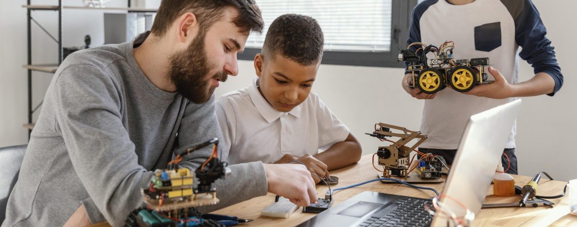 father-sons-making-robot