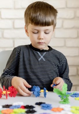 front-view-boy-playing-indoors