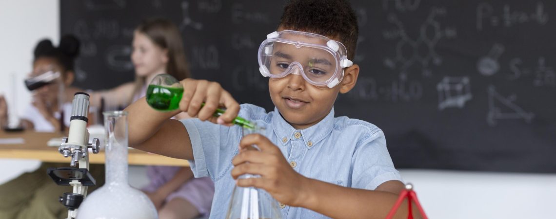 young-boy-learning-more-about-chemistry-class